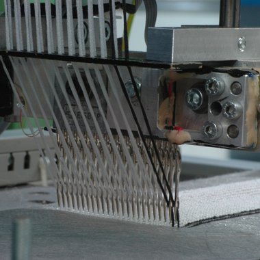 Tuftingvorgang inklusive Bestimmung der auf ein Nadelmodul wirkenden Kraft